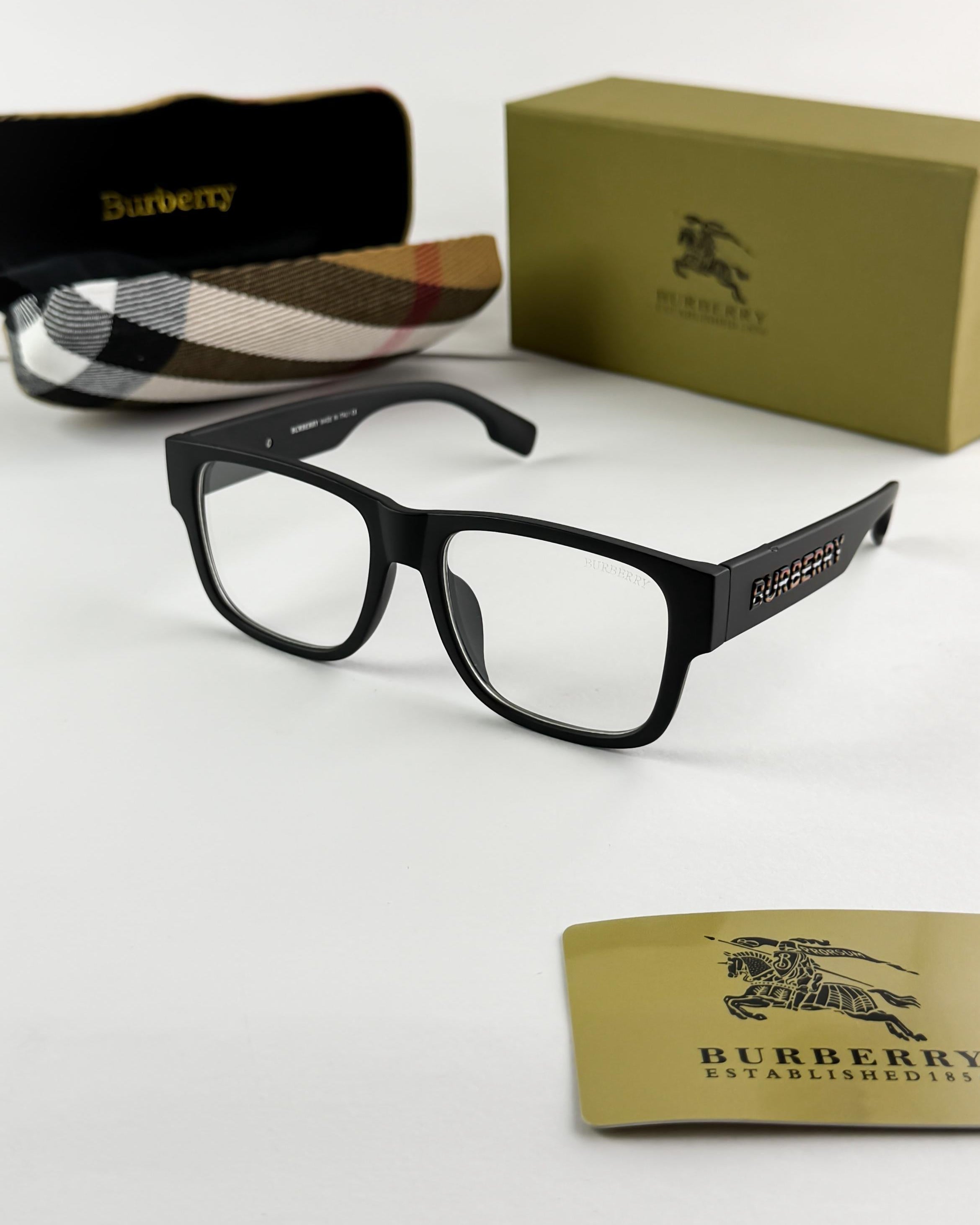 Black Burberry eyeglasses with packaging on a white background