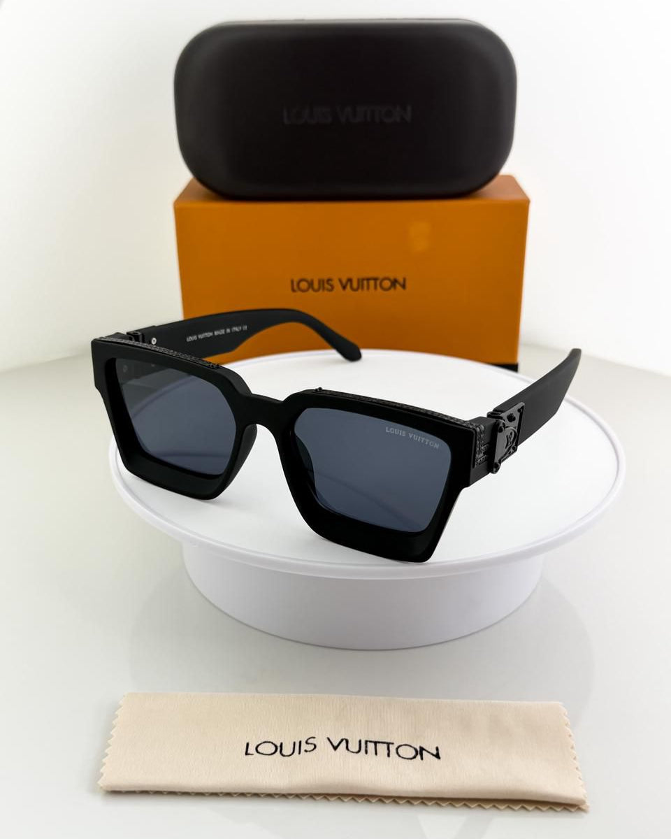 Black sunglasses with Louis Vuitton case and pouch on a white surface