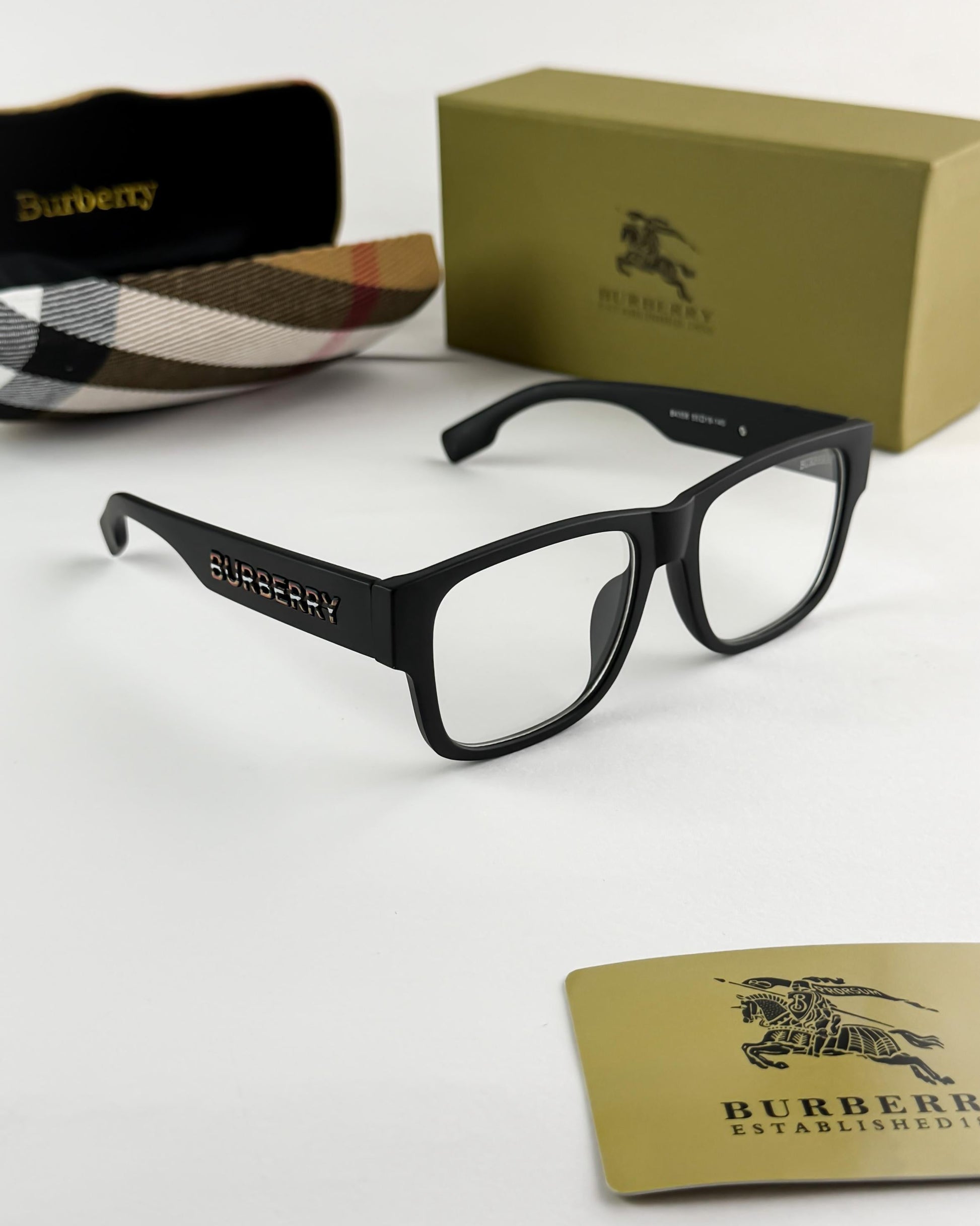 Black Burberry glasses with packaging on a white background