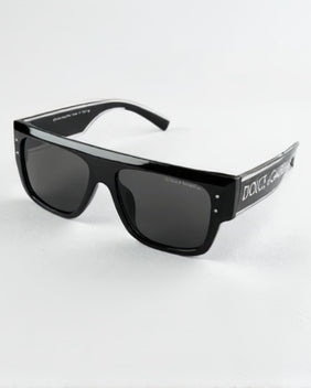 Black Dolce & Gabbana sunglasses on a white surface