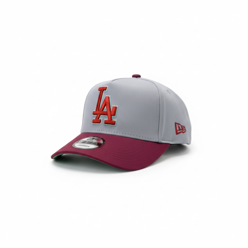 Grey and burgundy baseball cap front-left view on white studio background