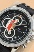 Close-up of chronograph dial with orange accents