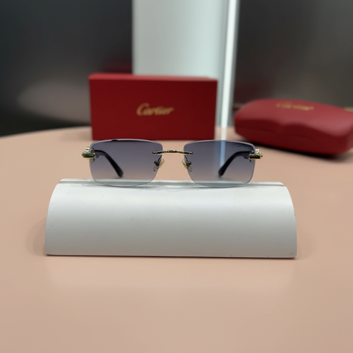 Cartier Panthère sunglasses on display stand - peach background