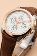 Close-up of multi-function chronograph dial with rose gold accents