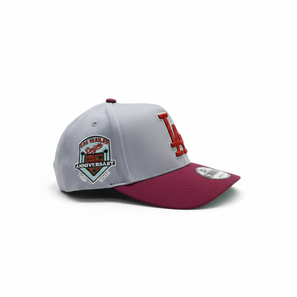 Grey and burgundy baseball cap right side view on white studio background