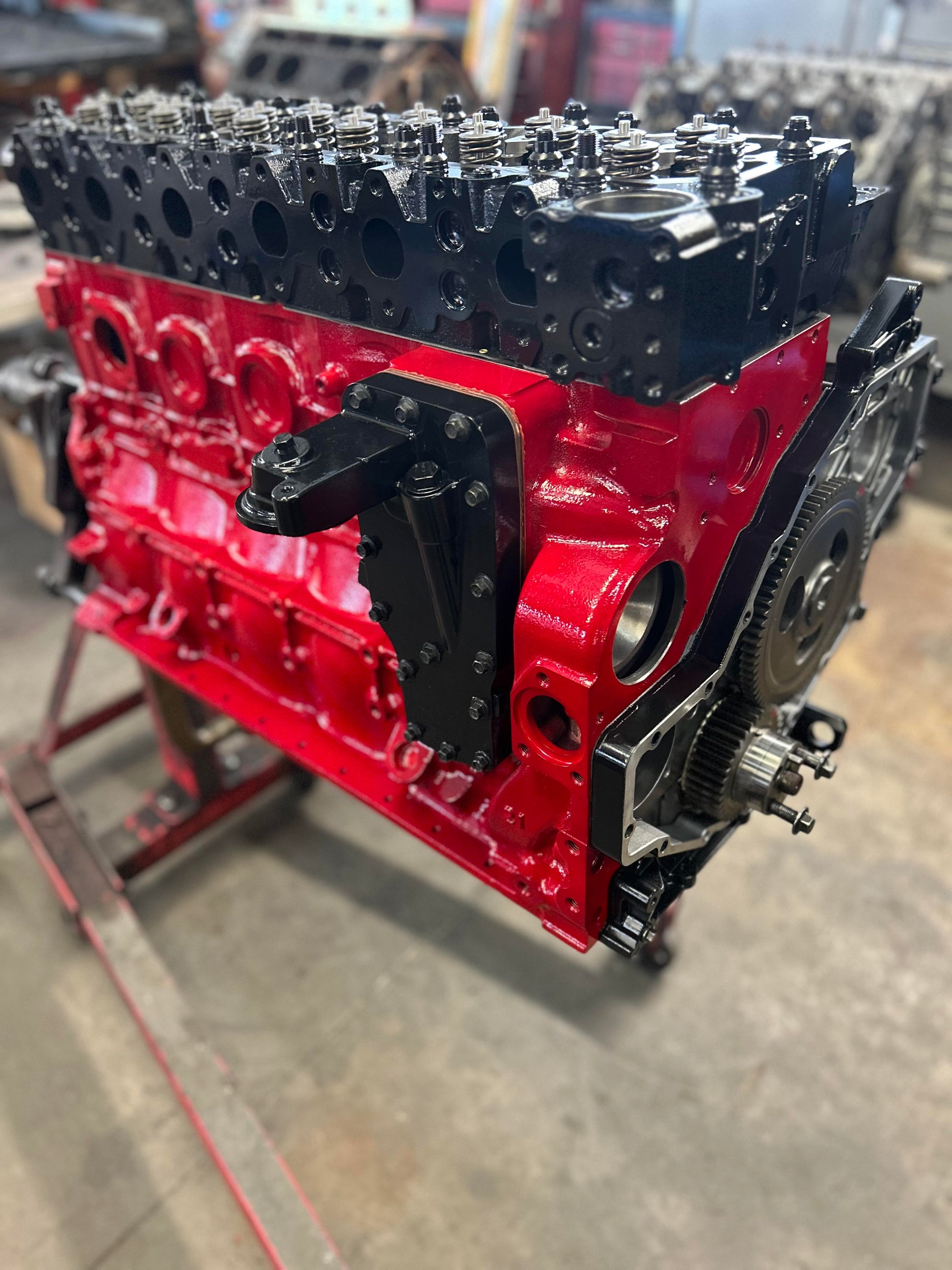 Woman applying perfume in front of a mirror with a vanity setup.